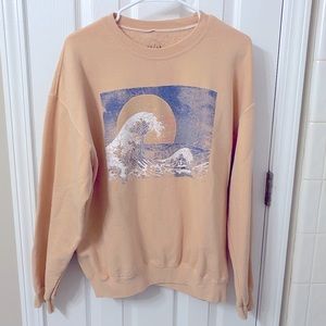 Cute peach sweater with design